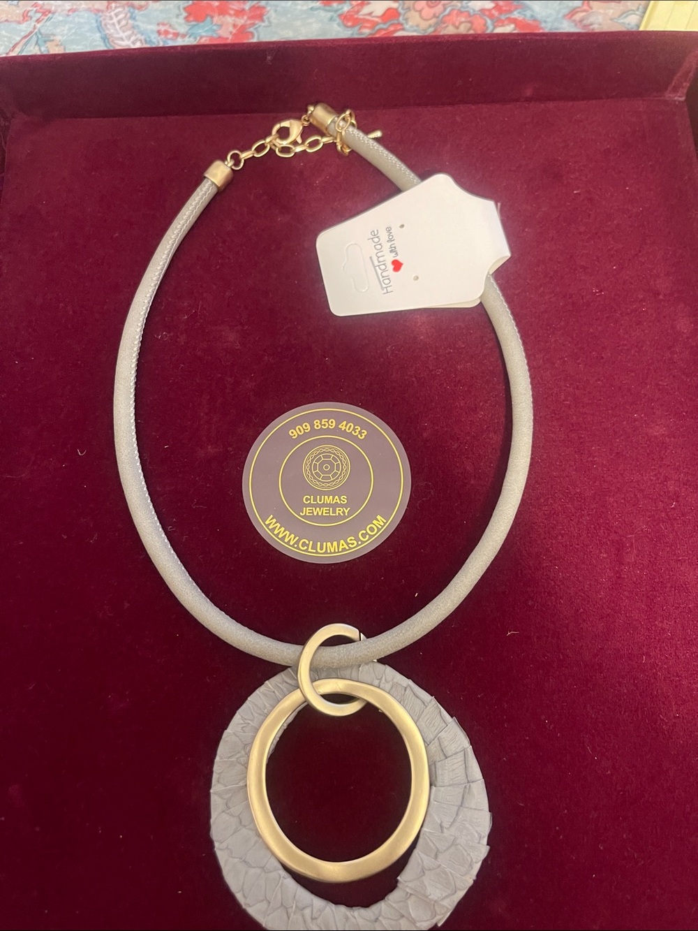 Clumas Women's Gray Leather Necklace with Gold Circular Pendant